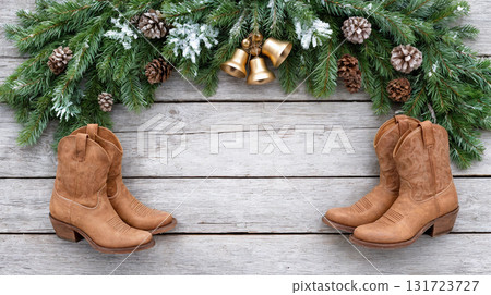 Western Christmas celebration featuring cowboy and cowgirl boots adorned with festive decorations and natural elements Western Christmas celebration featuring cowboy and cowgirl boots adorned with festive decorations and natural elements 131723727