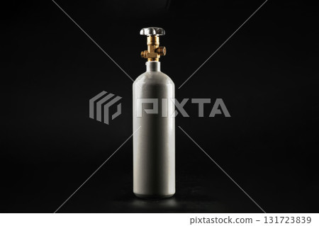 Gas cylinder on a black background, front view. For aquariums. Gas cylinder on a black background, front view. For aquariums. 131723839