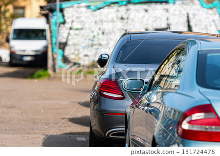 the yard of the city residential area is filled with parked cars 131724478