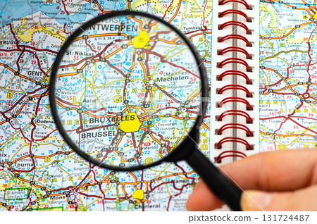 map of Bruxelles in Belgium through magnifying glass, travel destination concept 131724487