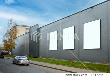 three blank white billboard for advertisement on the facade of building, outdoor advertising concept 131724498