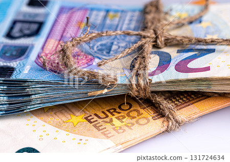 stack of euro banknotes tied with burlap string, close-up, wealth and prosperity concept stack of euro banknotes tied with burlap string, close-up, wealth and prosperity concept 131724634