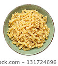Raw pasta Fusilli in  bowl isolated on white background. Raw and Dry Macaroni. Italian Culture. 131724696