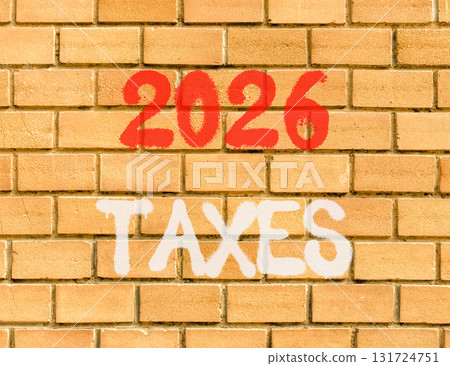 2026 taxes new year symbol. Concept words 2026 taxes on beautiful old brown brick wall. Beautiful old brown brick wall background. Business and 2026 taxes new year concept. Copy space. 131724751