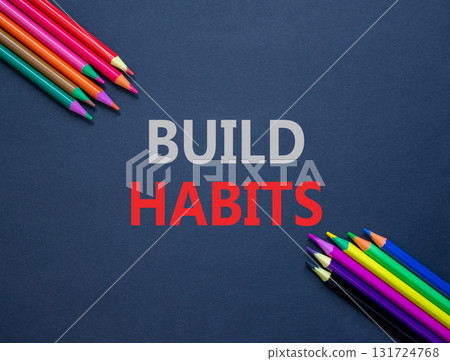 Build habits symbol. Concept word Build habits on beautiful black paper. Colored pencils. Beautiful black paper background. Business build habits concept. Copy space. 131724768