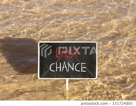 Last chance symbol. Concept word Last chance on beautiful black blackboard. Beautiful Red sea water background. Black blackboard. Business last chance concept. Copy space. Last chance symbol. Concept word Last chance on beautiful black blackboard. Beautiful Red sea water background. Black blackboard. Business last chance concept. Copy space. 131724805
