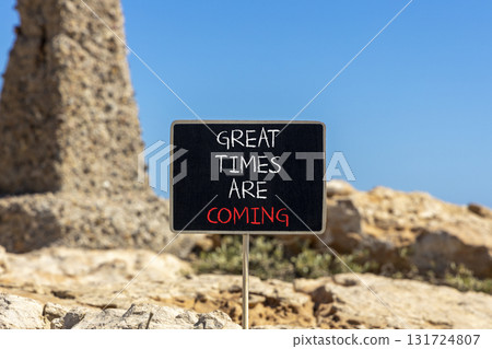 Great times are coming symbol. Concept words Great times are coming on beautiful black blackboard. Beautiful stone and blue sky background. Business great times are coming concept. Copy space. Great times are coming symbol. Concept words Great times are coming on beautiful black blackboard. Beautiful stone and blue sky background. Business great times are coming concept. Copy space. 131724807
