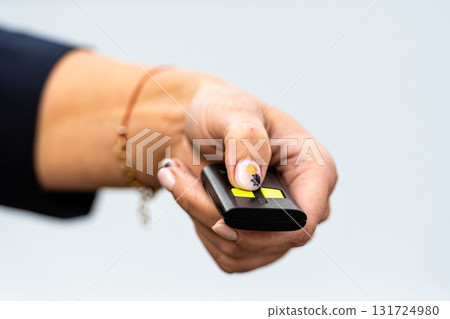 woman hand pushing button on remote control car key, close-up woman hand pushing button on remote control car key, close-up 131724980