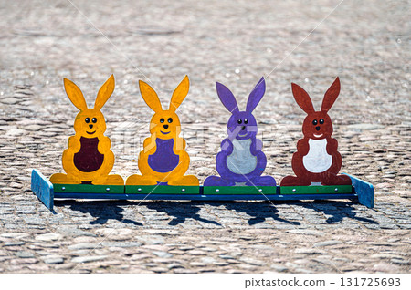 wooden bunny figures for throwing rings, Easter holidays, games for children in the town square wooden bunny figures for throwing rings, Easter holidays, games for children in the town square 131725693