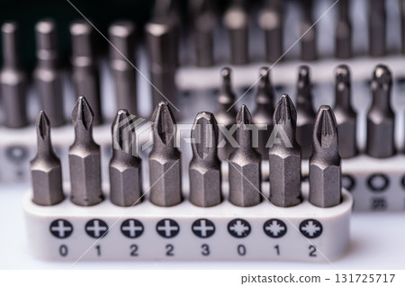 Interchangeable screwdriver bit set, isolated on white, selective focus,  dof, closeup 131725717