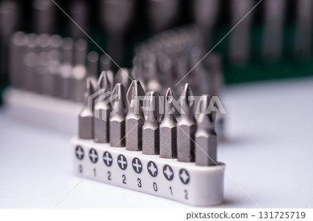 Interchangeable screwdriver bit set, isolated on white, selective focus, dof, closeup Interchangeable screwdriver bit set, isolated on white, selective focus, dof, closeup 131725719