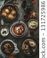An overhead view of a rustic autumn table spread with soup, cranberry-topped mashed potatoes, soft rolls, and cozy fall details. Designed for Thanksgiving themes, food blogs, or seasonal ads. 131725986