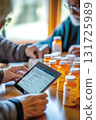 Editorial photo of a family caregiver assisting an elderly parent with setting up their digital prescription orders via a tablet, with prescription bottles and a digital calendar showing refill 131725989