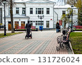 Young mothers walking with strollers near a historic building in Ulyanovsk 131726024