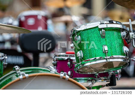 A set of plates in a drum set. At a concert of percussion music, selective focus, closeup 131726100