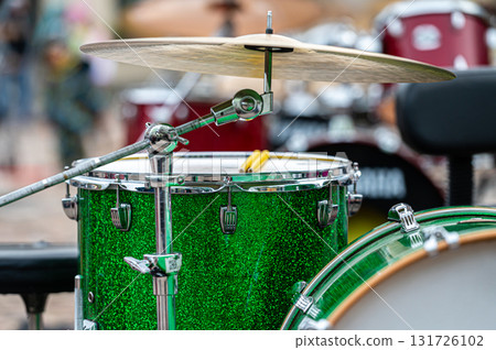 A set of plates in a drum set. At a concert of percussion music, selective focus, closeup A set of plates in a drum set. At a concert of percussion music, selective focus, closeup 131726102