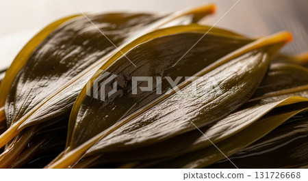 Detailed Close-Up of Pickled Wild Garlic Leaves with Glossy Texture Detailed Close-Up of Pickled Wild Garlic Leaves with Glossy Texture 131726668