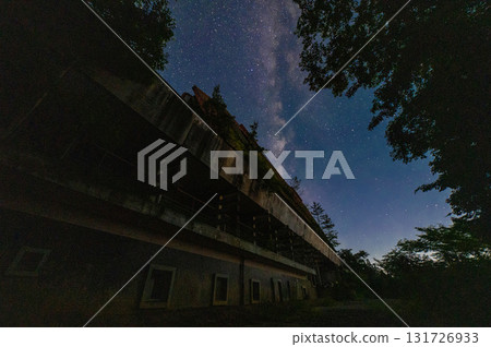 Abandoned hotel in the mountains and starry sky 131726933