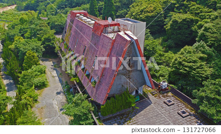 Drone aerial view of abandoned hotel in the mountains 131727066