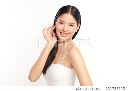 A beautiful young Asian woman with clean, fresh skin against a white background. Skincare, facial treatment, cosmetology, beauty, and spa. An elegant portrait of an Asian woman. A beautiful young Asian woman with clean, fresh skin against a white background. Skincare, facial treatment, cosmetology, beauty, and spa. An elegant portrait of an Asian woman. 131727315