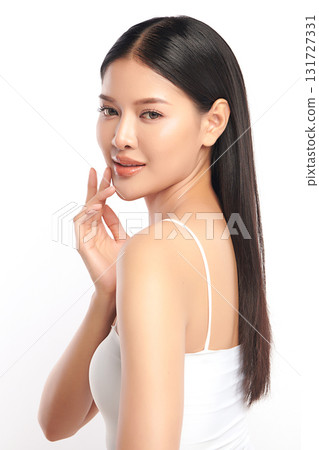 A beautiful young Asian woman with clean, fresh skin against a white background. Skincare, facial treatment, cosmetology, beauty, and spa. An elegant portrait of an Asian woman. A beautiful young Asian woman with clean, fresh skin against a white background. Skincare, facial treatment, cosmetology, beauty, and spa. An elegant portrait of an Asian woman. 131727331