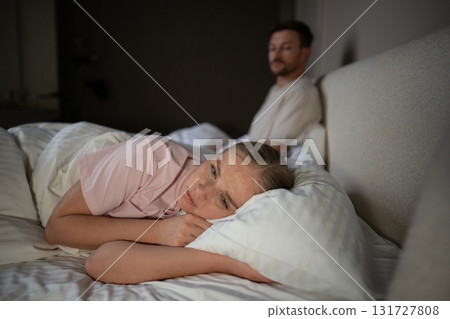 Emotional distressed woman create distance in marital bed due to unresolved intimacy issues Emotional distressed woman create distance in marital bed due to unresolved intimacy issues 131727808