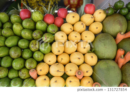 Close-up view of apples, carrots and tropical fruits: mango, avocado, guava, pomelo in Vietnam Close-up view of apples, carrots and tropical fruits: mango, avocado, guava, pomelo in Vietnam 131727854