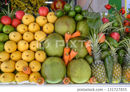 Apples, carrots and tropical fruits: mango, avocado, guava, pomelo, pineapples, pomegranates Apples, carrots and tropical fruits: mango, avocado, guava, pomelo, pineapples, pomegranates 131727855