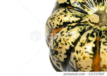 A spooky Halloween Pumpkin Squash in Unique Abstract Orange and Green Colours on White Background 131727897