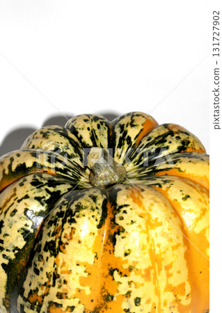 A spooky Halloween Pumpkin Squash in Unique Abstract Orange and Green Colours on White Background A spooky Halloween Pumpkin Squash in Unique Abstract Orange and Green Colours on White Background 131727902
