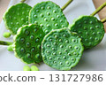 Fresh Green Edible Lotus Seed Pods on a White Tray 131727986