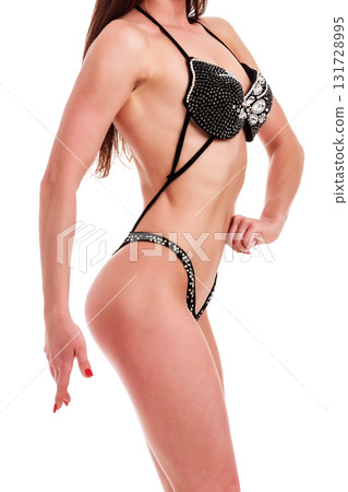 Young beautiful athletic girl with sexy body in bikini. Isolated on white background. Young beautiful athletic girl with sexy body in bikini. Isolated on white background. 131728995