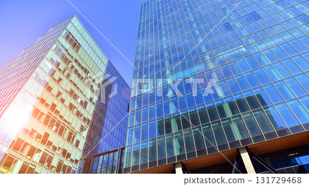 Bottom up view of  modern glass office building. Commercial real estate. New commercial office building in modern city. 131729468