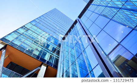 Bottom up view of  modern glass office building. Commercial real estate. New commercial office building in modern city. 131729475