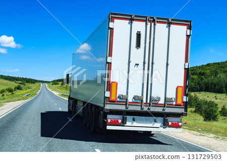 Picture of big truck with the trailer moves on the highway Picture of big truck with the trailer moves on the highway 131729503