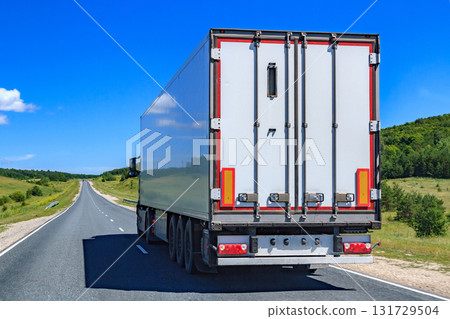 Picture of big truck with the trailer moves on the highway Picture of big truck with the trailer moves on the highway 131729504