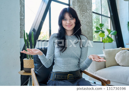 Web cam view of young woman talking looking in camera, online meeting, video call 131730396