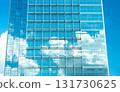 Skyscraper reflections merge clouds and glass into a vision of modern harmony. 131730625