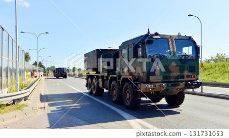 Warsaw, Poland. 15 August 2025. Polish army military convoy. Wheeled armored vehicles drive on highway. 131731053