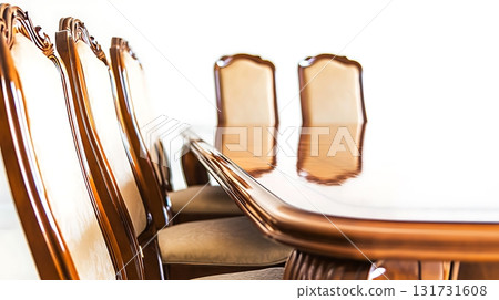 A wooden dining table with six chairs around it 131731608