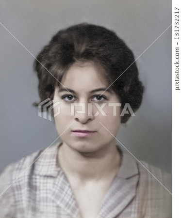 Vintage portrait of a serious young woman with a hairstyle. Retro photograph, 1962. Vintage portrait of a serious young woman with a hairstyle. Retro photograph, 1962. 131732217