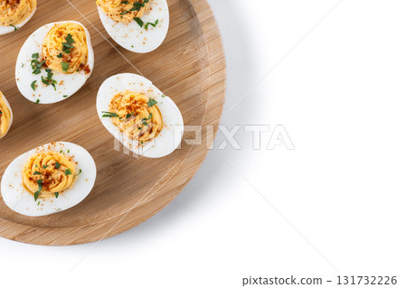 Homemade hard Boiled Deviled Eggs garnished with herbs Homemade hard Boiled Deviled Eggs garnished with herbs 131732226