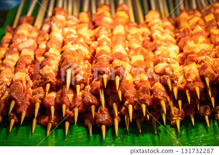 Delicious skewered meat displayed at a street market Delicious skewered meat displayed at a street market 131732287
