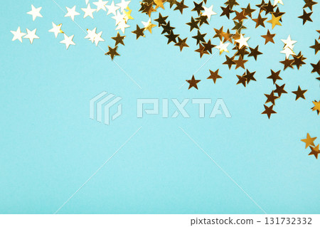 Golden glitter stars on blue background 131732332