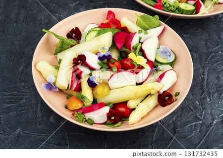 Fresh mixed salad with edible flowers. 131732435