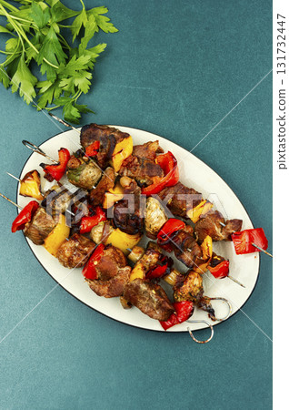 Ready-to-eat meat on skewers. 131732447