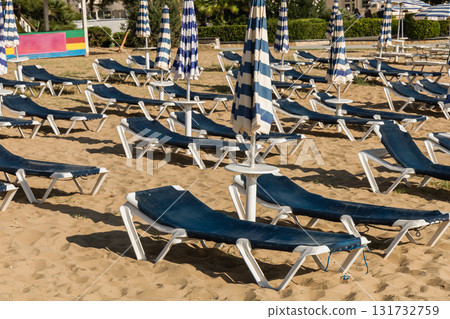 Quiet yellow sand beach with sunbeds Quiet yellow sand beach with sunbeds 131732759