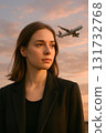 Brunette woman portrait outdoors airplane sunset background 131732768