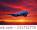 Airplane flying sunset sky bright vibrant clouds 131732770