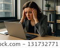Young brunette woman stressed at laptop office 131732771
